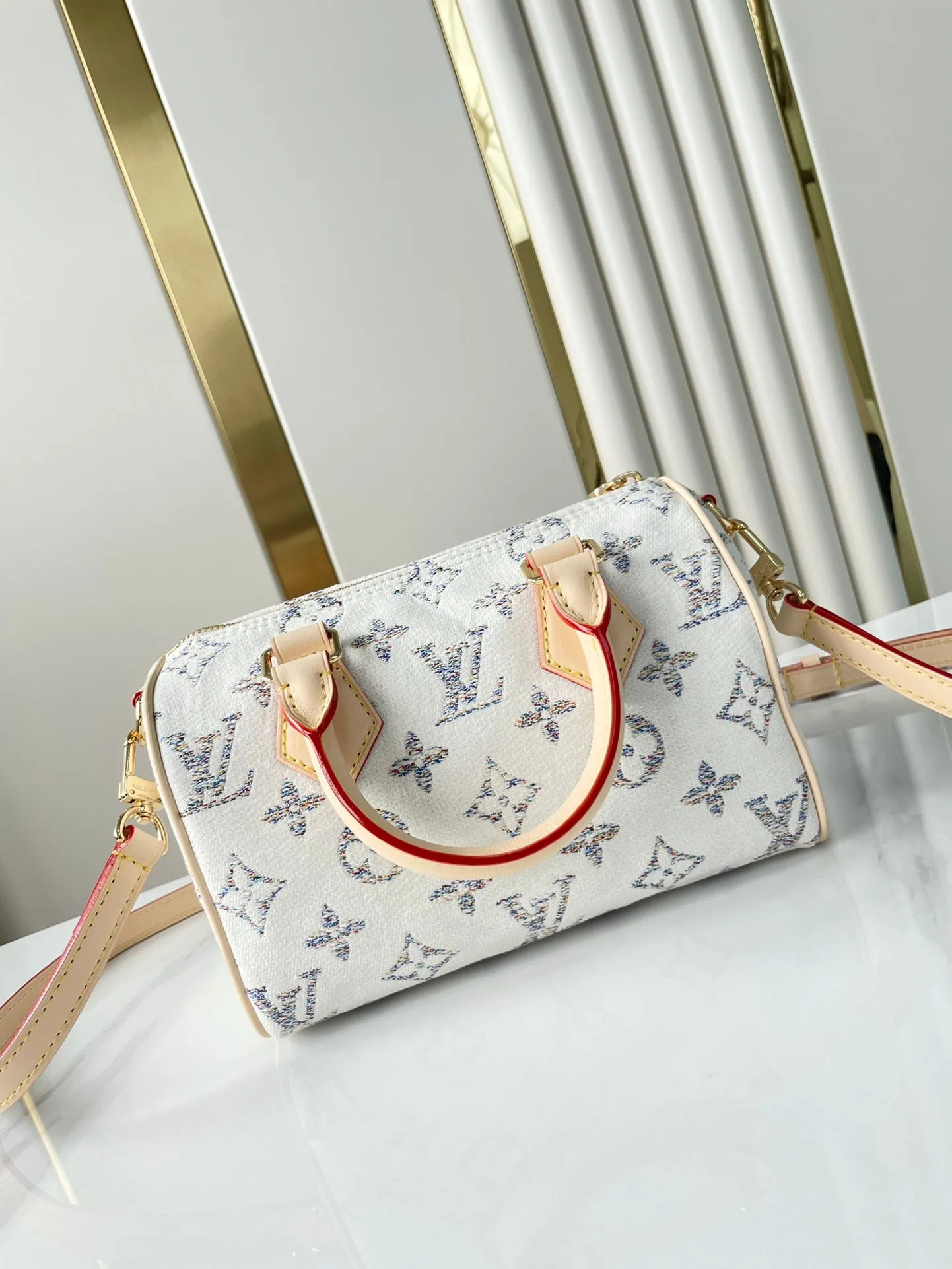 Louis Vuitton SPEEDY BANDOULIRE 20 IN WHITE MONOGRAM JACQUARD FABRIC AND BEIGE CALFSKIN TRIM
