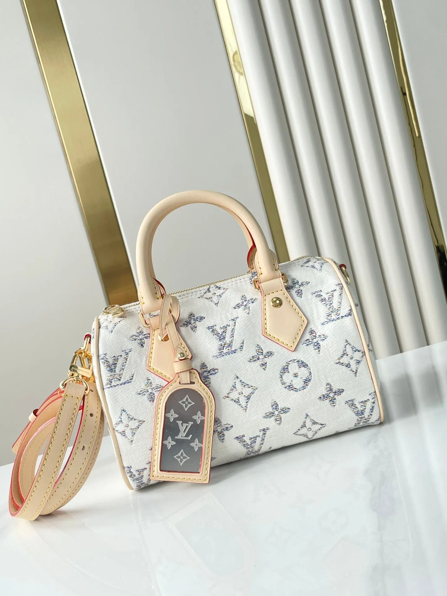 Louis Vuitton SPEEDY BANDOULIRE 20 IN WHITE MONOGRAM JACQUARD FABRIC AND BEIGE CALFSKIN TRIM