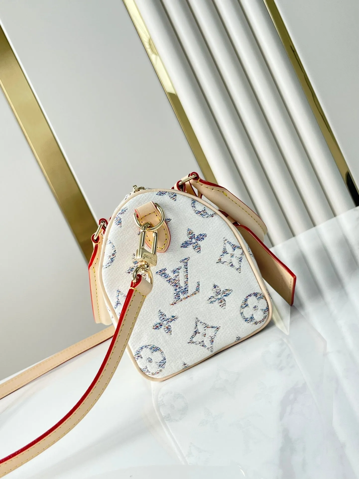 Louis Vuitton SPEEDY BANDOULIRE 20 IN WHITE MONOGRAM JACQUARD FABRIC AND BEIGE CALFSKIN TRIM